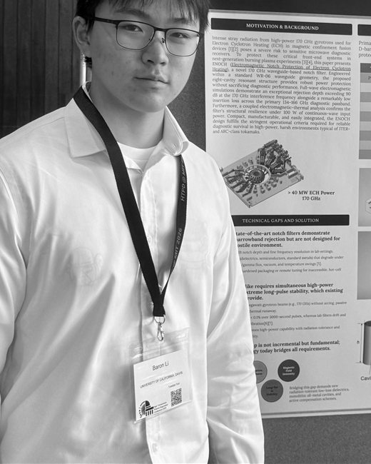 Baron Li standing beside a research poster